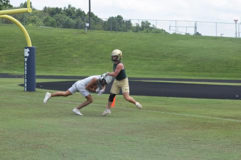 Kanaan Cleveland, left, shown hauling in a touchdown pass  during a 7-on-7 game earlier this summer, and the rest of the Warriors spent two day this week at an FCA Team Camp at Jacksonville State University in Alabama.  (Photo/Mark Turner)