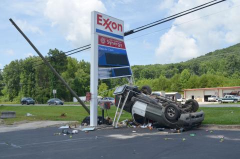 One person has been charged after hitting an Exxon Gas Station sign on Wednesday, July 14. (Photo/Stephanie Hill)