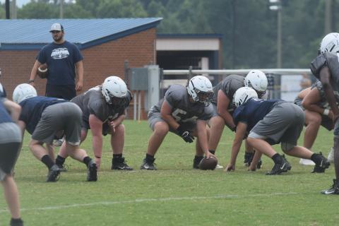 WCHS center Trenton O'Kelly, above, and the Warriors head to East Forsyth Friday for a preseason scrimmage with the Broncos. (Photo/Mark Turner)
