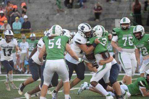 White County's Alex Thornton, left, and Matthew Gee stop Pickens' running back Kadyn Hampton at the line of scrimmage during the Warriors' 20-7 win last Friday night in Jasper. (Photo/Mark Turner)