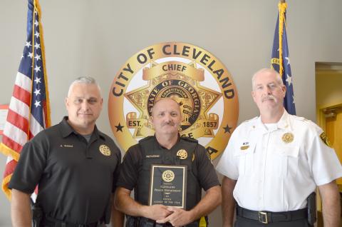 The Cleveland Police Department’s Maj. Aaron Weiland, officer Ray Rutledge and Chief Jeff Shoemaker are shown with the Agency of the Year award. (Photo/Stephanie Hill)