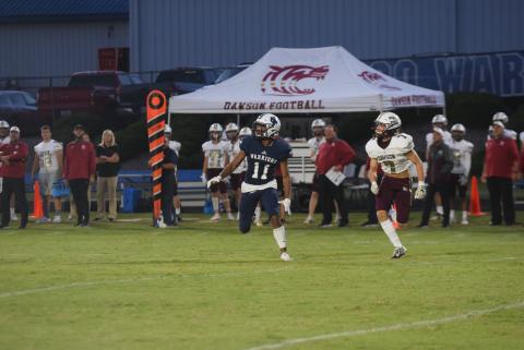 Darius Cannon gets set to haul in a pass in front of Dawson County's Brendan Hubbard during the region opener. (Photo/Mark Turner)