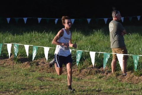 Lance Kelley was one of the top runners for the Warrior cross country teams during the Warpath Invitational  in Canton. (Photos/Mark  Turner)