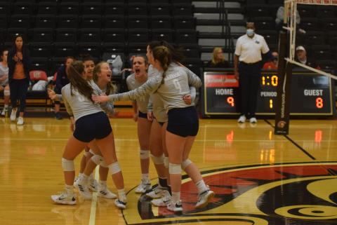 Brooklyn Thomason, left, and Maggie Blair celebrate after a point during the opening set of the first round match Tuesday at Greater Atlanta Christian. (Photo/Mark Turner)