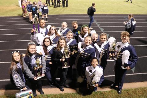 White County High School marching band members pose with some of the hardware won during their recent band competition. (Submitted photo)