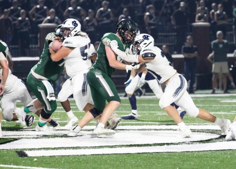 Malachi Zellars, right, battles a North Halllinemen during the game. (Photo/Staci Sulhoff)