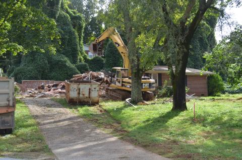 A former home at the corner of Quillian Street and South Main Street in Cleveland was demolished earlier this week at the site planned for construction of a Popeyes restaurant and T-Mobile store. (Photo/Stephanie Hill)