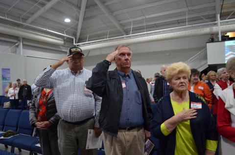 U.S. Army veterans Harold Nix (left) and Craig German salute during a presentation honoring each branch of the American military. (Photos/Stephanie Hill) 