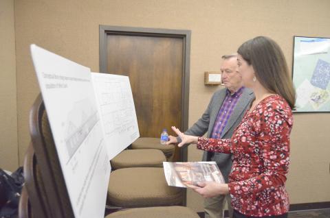 Northeast Georgia Regional Library System Director Delana Knight discusses a concept design for a new library with White County Commissioner Terry Goodger. (Photo/Wayne Hardy)