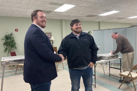From left, CJ McDonald and Jeremy McClure shake hands after the unofficial vote totals showed them as winners in the Cleveland City Council elections. (Photo/Wayne Hardy)