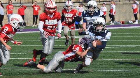 White County's John Jarrard is brought down by a Copper Basin defender during the Mountain Athletic Conference's fifth-grade semifinal game last weekend at Lumpkin County High School. (Photo/Mark Turner)