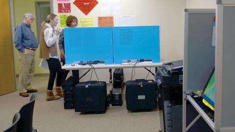White County Election Supervisor Akyn Bailey, middle, previews the voter training precinct to county Board of Elections & Registration board members Mike Mays and Louise Nix. (Photo/Wayne Hardy)