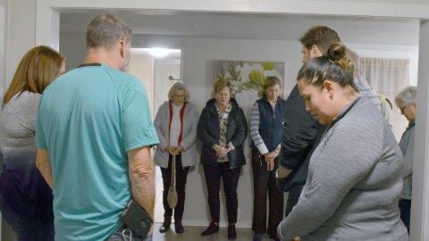 Supporters of the Family Promise rezoning request held a prayer circle Monday at the new West Kytle Street property prior to Monday’s city council meeting. (Photo/Ashley Blair)