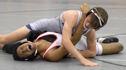 White County's Caden Autry pins Archer's MJ Maze during the Hook'Em Holiday Classic last week at Lambert High School. Autry won the 120-pound division title with a 4-0 record. (Photo/Mark Turner)