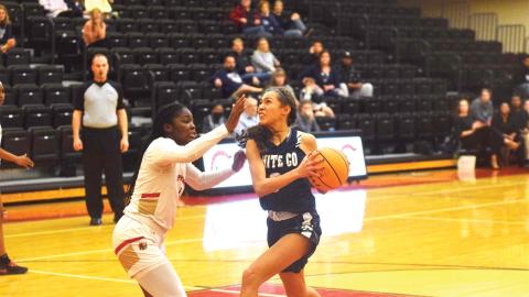 Aaliyah Anderson, right, heads to the basket against Greater Atlanta Christian's Myla Benton during the Class AAA state tournament game Monday in Norcross.