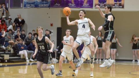 Jadon Yeh gets off a desperation shot from half court at the end of regulation durning the 7-AAA championship game. 