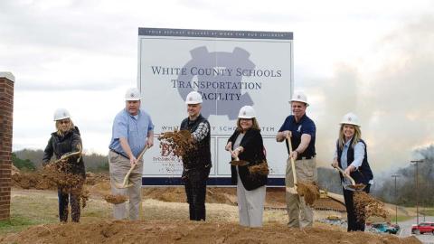 Board of Education members toss dirt in front of the site next to Tesnatee Gap Elementary School. Shown from left are Linda Erbele, John Solmon, John Estes, School Superintendent Dr. Laurie Burkett, Charlie Thomas, and Missy Jarrard. (Photo/Ashley Blair)