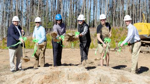 Officials from the City of Cleveland, construction team members, and leaders from the Woodlands Camp gathered to break ground on this new cabin. Pictured from left are Cleveland Mayor Josh Turner, Charles Black Construction Project Manager Rod Nix, Paul Odom of Bradfield, Richard, and Rhodes & Associates Architects, Camp Director John Estes, Site Director Bradley McDuffie and Zac LaHayne of Foothills Land Design. (Photo/Ashley Blair)