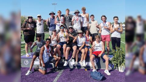The White County Warriors celebrate after winning the Region 7-AAA track championship last Friday at Cherokee Bluff High School. The region title is the second straight for the boy's program. 