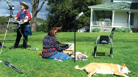  Jo Kelly (left) and Lorraine Kimsey enjoying a windy day on the lawn at the Stovall House. 