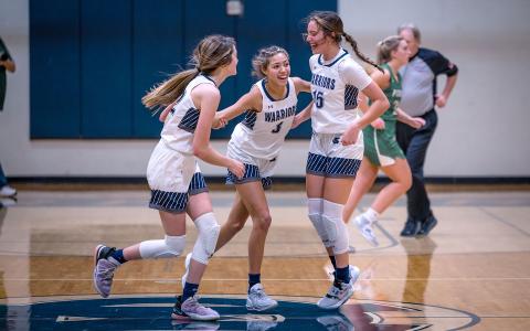 Kylie Watkins, left, and Naomi Roberts, right, celebrate with Aaliyah Anderson moments after Anderson hit a shot at the buzzer to knock off Pickens County 53-52 in a region matchup Tuesday in Cleveland. (Photo/Austin Barrera) 