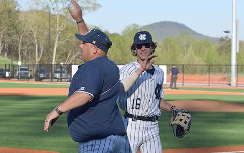 WCHS assistant coach Jason Norton, left, celebrates with Kyler Mayo during the win over Gilmer. (Photo/Mark  Turner)