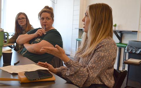 Kayla Ellis and Susie Murray listen as Marci Brown explains challenges Cleveland Drug faces. (Photo/Samantha Sinclair)