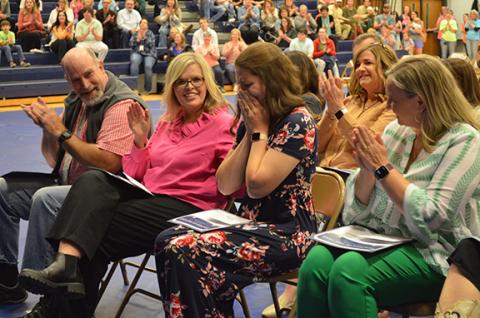 White County School System Teacher of the Year Holly Witcher places her head in her hands as fellow school honorees Brad Abernathy, Tina Vandiver and Meredith McConnell congratulate her. (Photos/Samantha Sinclair)