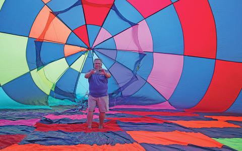 As Candy Crush is inflated for the very first time, Dave Bristol documents the occasion from inside the envelope. (Photo/Jessica Wood)