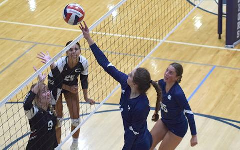 White County middle hitter Emma Kerley makes a play on a ball at the net during a match against Chestatee Tuesday at the WCHS gym. (Photo/Mark Turner)