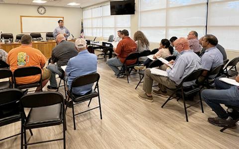 More than a dozen people attended a meeting in Cleveland to learn about the application process to operate a package store under the city’s new ordinance. (Photo/Linda Erbele)