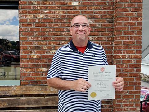 Sports Editor Mark Turner won third place in the Sports Coverage category. (Photo/Samantha Sinclair)