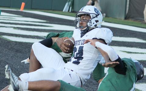 Noel Lammers drags down a couple of North Hall defenders at the end of a 16-yard touchdown run to tie the game at 7-7 in the first quarter. (Photos/Mark Turner)