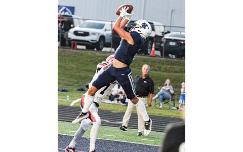 John Phillips leaps to grab a pass in the back of the end zone for a touchdown during the first quarter of the Homecoming game against Stephens County. (Photo/Staci Sulhoff)