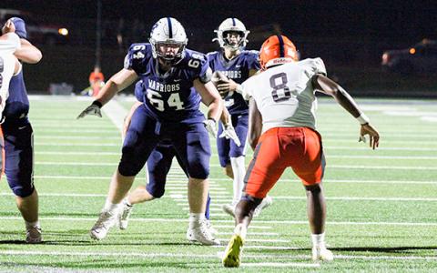 Tyler Seymour blocks for Tripp Nix during a game earlier this season.  (Photo/Staci Sulhoff)