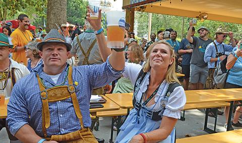 Michael and Kristina Cromer toast with the crowd. (Photo/Samantha Sinclair)