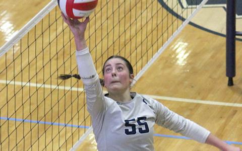 Linsey Burke, the 7-AAA Player of the Year, makes a play on a ball at the net during Tuesday's tournament win.  (Photo/Mark Turner)