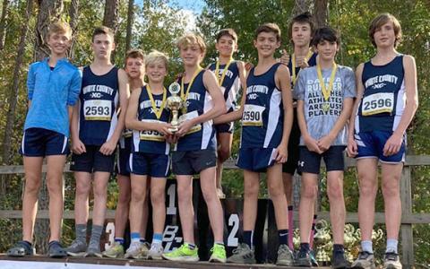 WCMS runners, front left, Weaver Bartlett, Wes Jones, Jax Adams, Reid Murphey, Aiden Cline, Ayden Mendez, Cam Biddy, Aden Hill, Weston Waller, and Briggs Murray show off the runner-up trophy at the state last weekend in Cochran. (Photo/WCMS Athleitcs)