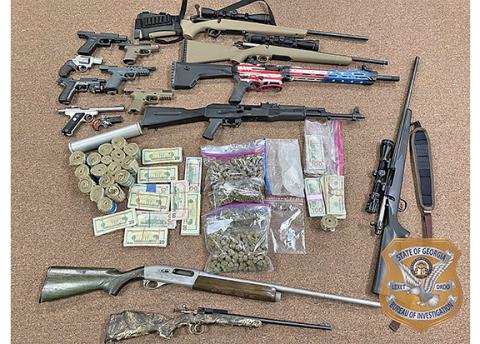 Guns, drugs and money found in the home of Michael Thompson of Cleveland. (Photo/submitted)