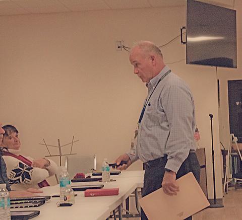 Planning Director Harry Barton sets down his recorder at the planning commission meeting for the final time. (Photo/Noah Johnson)