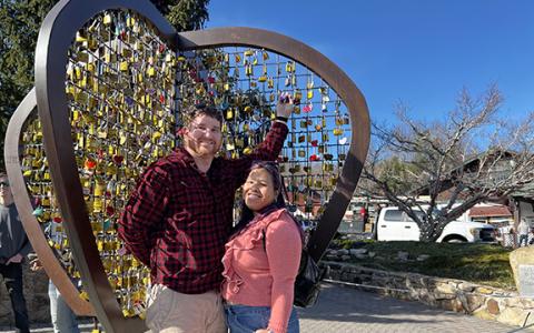 Valerie and Marcus Sussman, of Orlando, celebrated their third wedding anniversary with a trip to Helen, which included placing a lock on Saturday to symbolize their union on the Love Locks Balloon in downtown Helen. “We can’t wait to come back and see if our lock is still here,” Valerie Sussman said. (Photo/Linda Erbele)