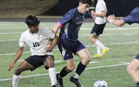 Preskitt Castleberry, right, scored the game-winning goal late in the second overtime period in the Warrios' 1-0 win over Pickens.  (Photo/Mark Turner)