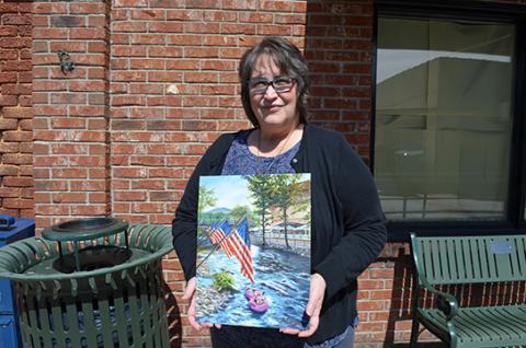 Rebecca Carfizzi’s painting, “Fourth of July in Helen” won this year’s Scoop cover contest. (Photo/Samantha Sinclair)