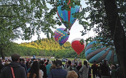 Spectators gathered to watch balloons take off for the race on Thursday morning. Cleiman described the Thursday morning crowd as the largest she ever remembers seeing. (Photo/Eric Tiongson)