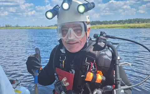 David Smith gives a thumbs-up before diving in to hunt for fossils. (Photo/submitted)
