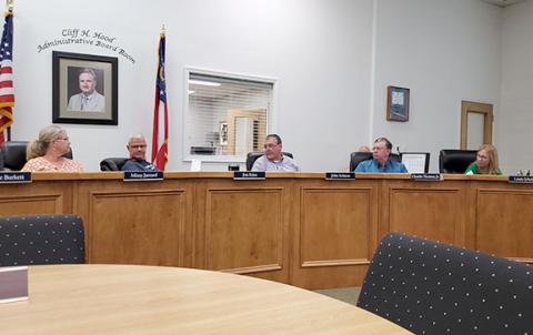 School board members Missy Jarrard, Jon Estes, John Solmon, Charlie Thomas and Linda Erbele discuss the rolling back the millage rate Tuesday morning. (Photo/Samantha Sinclair)