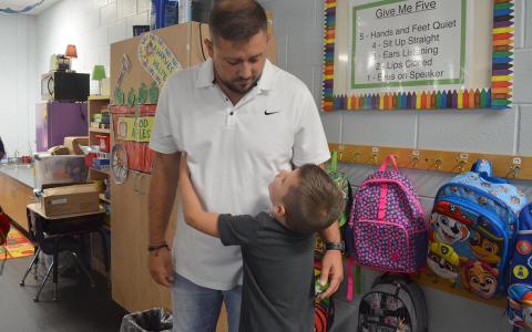 Rylan Tanner gives his dad one of many hugs before starting his first day of kindergarten in April Teems’ classroom at Mt. Yonah Elementary School. (Photo/Samantha Sinclair)