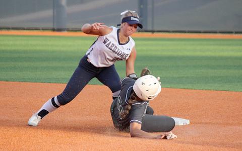 Emma Hare puts a tag on North Hall's Genesis Satterfield on a close play at second base during the region matchup Monday afternoon in Cleveland.(Photo/Mark Turner)