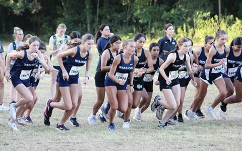 White County runners, from left, Carly Black, Maddie Evans and Emma Windham take off at the start of the girl's varsity race last week at the North Hall Invitational. (Photo/Mark Turner)