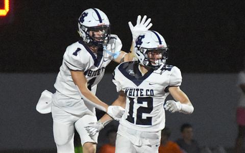 Zach Godfrey, right, celebrates with Gaines Clark after Godfrey picked off a pass and went 43 yards for a touchdown in the third quarter.  (Photo/Basil Ray)